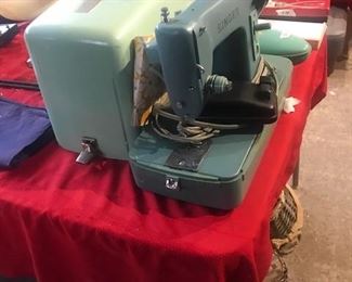 Singer sewing machine with case.