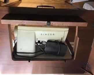 Vintage Singer sewing maching in table
