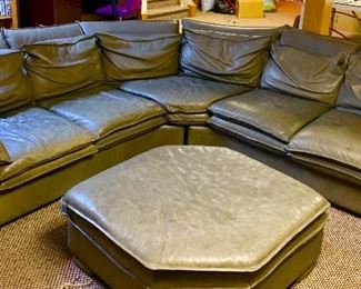 Gun metal leather sectional sofa.