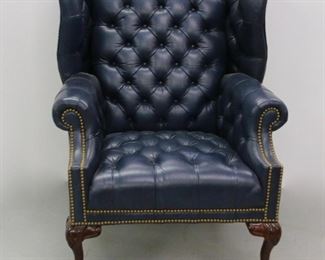 Tufted leather wing chair