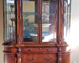 Gorgeous china cabinet with curved glass.