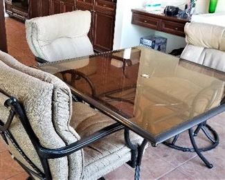 Glass kitchen/dining table and chairs.