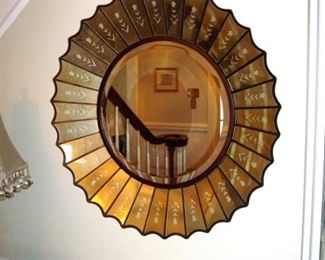 Etched facet wall mirror.