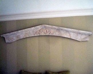 Hand decorated wooden crest. Used as headboard over queen bed.