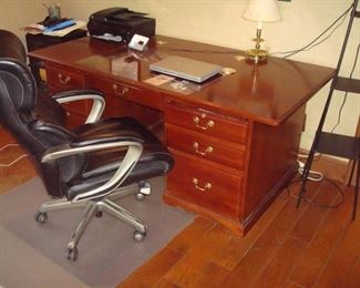 Professional cherry office desk and Lazy-boy office chair.