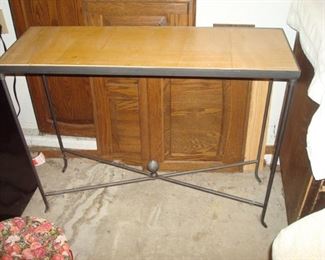 One of three wood and metal tables.