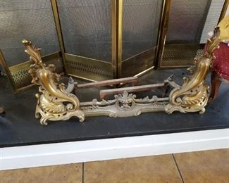 antique fireplace andirons and fence