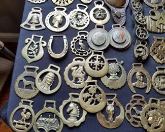 large selection of decorative brass horse harness medallions