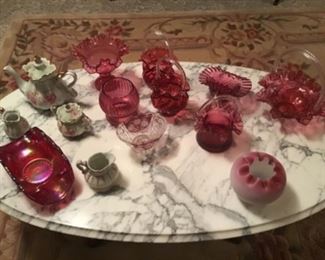 Marble top Heirloom Reproduction coffee table and a few of the many pieces of Cranberry glass. 