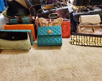This woman had more purses than Costco has those sample Ladies.  I love those ladies though.  Free Lunch on Saturdays.  Go there after my sale.  Then come back and spend all of the money you saved.  CoCo, Michael Kors, Chico's, Louis Vuitton, etc.