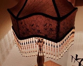 Her name is Chandelier.  She dances in clubs.  That is why she has those tassels