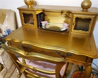 Gold Writing Desk.  You can write to your prison pen pal from this very desk.