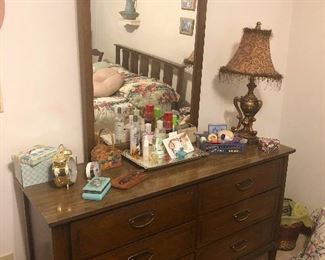 60's mirror dresser reflecting lonely bed (which is the kind of bed you want!)