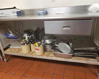 Kitchen contents under table and in drawer