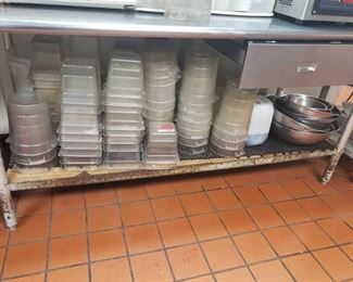 Kitchen contents under table and in drawer