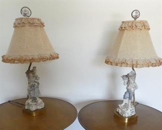 Antique lights with ceramic statues of a boy and girl on the bases:  lights work but will probably need new shades.  One finial needs to be repaired. Ceramic statues are in excellent condition. 