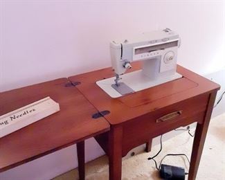 Singer sewing machine with cabinet 