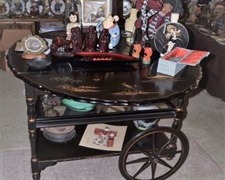 Antique Tea Cart with Hand carved motifs on each drop side.