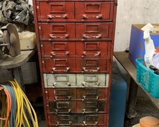 Metal cabinet with pull out trays