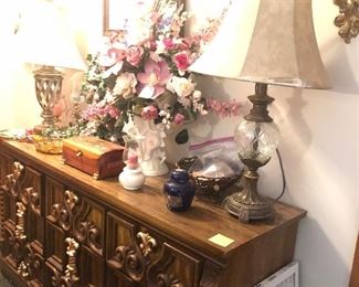 credenze, lamps, floral arrangements