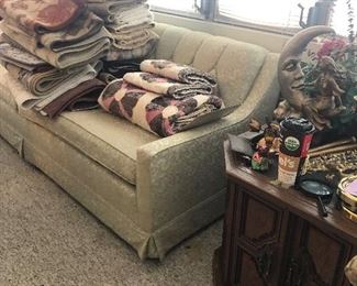 vintage sofa, quilts, blankets, end table