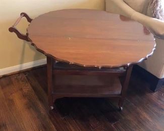 Antique Late 1800s Drop Leaf Tea Cart
Has a drawer & glass removable tray. 
Wood caster wheels.
28” tall overall, 27 1/2” tall to tabletop
41” total length, 37 1/2” long tabletop
17” wide.
Add an additional 14” for each leaf.