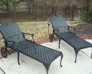 Garage:  These two black metal lattice pattern chaise lounges are priced separately and are now in the garage.
