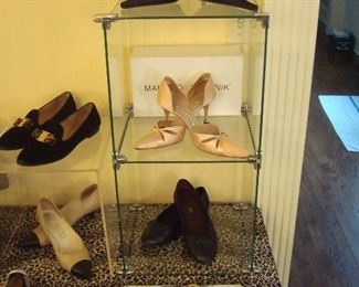 Dining Room-THE Boutique:   More foot candy!   From top to bottom:  Anne Klein; Manolo Blahnik (with box); and Chanel shoes.  The small coin change purse  is by Ippolita; and the black leather gloves with ruffles are Italian made.  