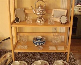 Dining Room:  Two sets of WATERFORD crystal candlesticks flank a signed crystal bowl.  Also shown are photo frames, a silver-plate tea pot on stand, and more Wedgwood, crystal, and vintage dessert sets.