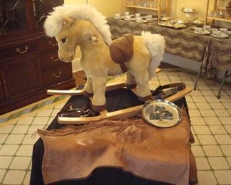 Dining Room:  Need a VERY NICE baby gift for a very special baby?  This is it!  A like-new "Franzi" STEIFF rocking pony!  He is the cutest!  And, if you're going to have a horse,  you better have stirrups, a horse embroidered belt, and chaps to go with it!