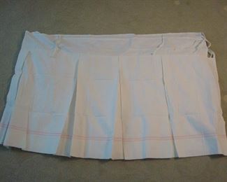 Master Bedroom-First Floor:  Many of the window treatments were taken down to be sold.  Shown is one POTTERY-BARN KIDS valance.  It is white, trimmed in pink, with tie tops.  It measures 31" x 96" wide.