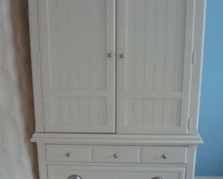 Bedroom #2-Upstairs:  A creamy white WAVERLY armoire has two upper doors and three lower drawers.  It measures 43" wide x 23" deep x 75" tall.