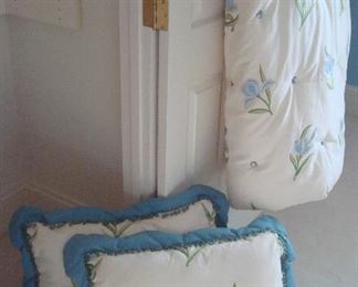 Bedroom #1-Upstairs:  A custom made queen size comforter and matching shams have an ivory background with embroidered blue flowers.  