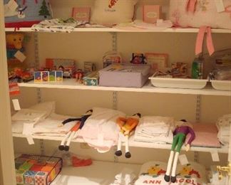Lower Level-Closet:  Children's banks, linens, toys, stools, and riding toys are all shown.