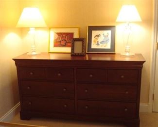 Lower Level-Bedroom: The six drawer dresser matches a nearby night stand.  Both are in excellent condition!  The clear glass lamps are sold as a pair, while the items shown on the dresser are individually priced.