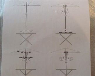 Garage:  There are two BRAND NEW-Still-In-The-Box CRATE & BARREL umbrella chandeliers for sale. We did not want to unwrap them but we photographed the diagram for you  You're on your own now with set up.