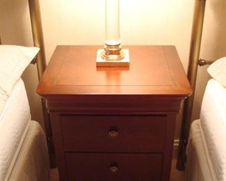Lower Level-Bedroom: The night stand/chest has three drawers and matches the nearby 6-drawer dresser previously shown, but they are separately priced.  The heavy clear glass lamp has a copper and brass base.