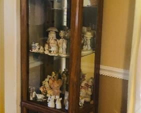 Lighted Curio cabinet/lots of figurines including a collection of angels/ precious moments