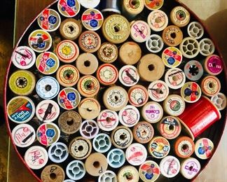 A lot of thread and wooden spools