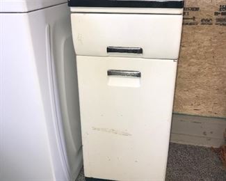 Small vintage metal kitchen cabinet with porcelain top.
