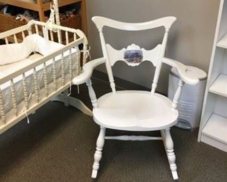 A beautiful crib, rocking chair for your new, little one.