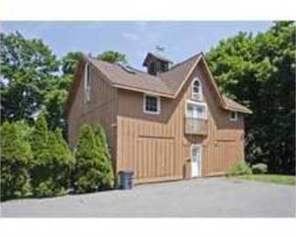 The barn has furniture and paintings 