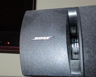 Bose speaker system attached to TV.