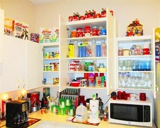 Small kitchen appliances, kitchenware, new cans of food, beverages and spices .