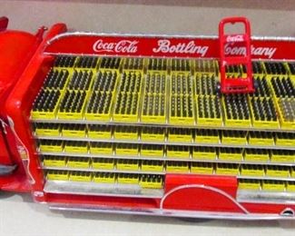 Coca-Cola delivery truck   1950 s. Bottle cases removable. Model is made of metal.