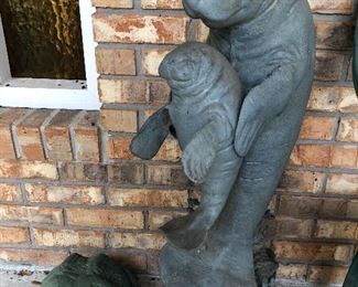 Large Manatee and baby statue in metal.  Concrete frog