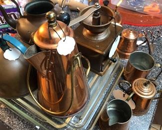 Copper teapots, cream and sugar, mug, coffee grinder