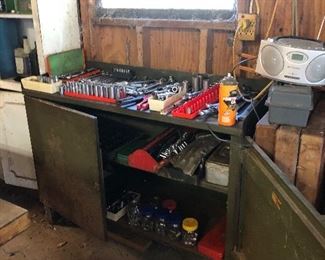 Metal cabinet.  Misc sockets, ratchets, hand tools