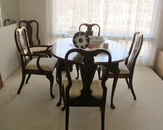 Cherry wood dining table w/two leaves & six chairs, two have arms