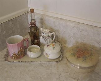 Lots of antique china, lots of pink